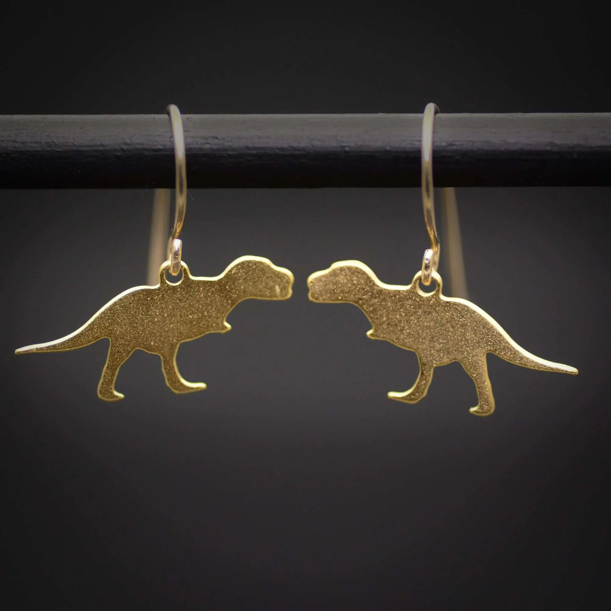 T-rex earrings, gold dinosaur dangle earrings