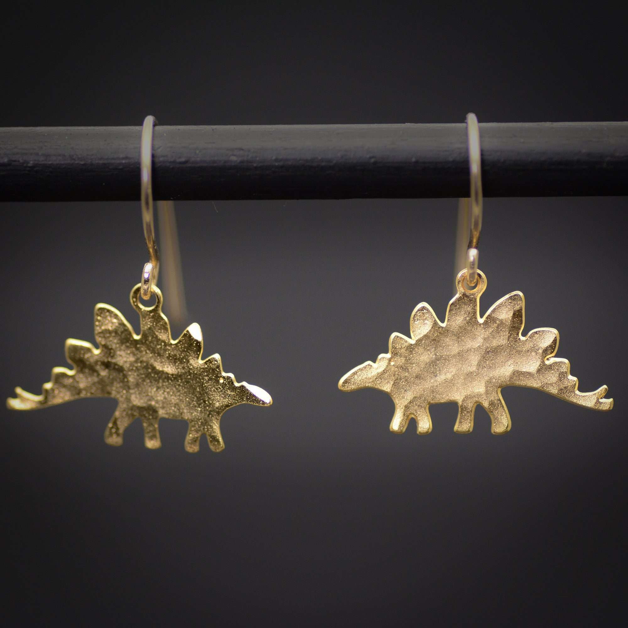 stegosaurus earrings, gold dinosaur dangle earrings