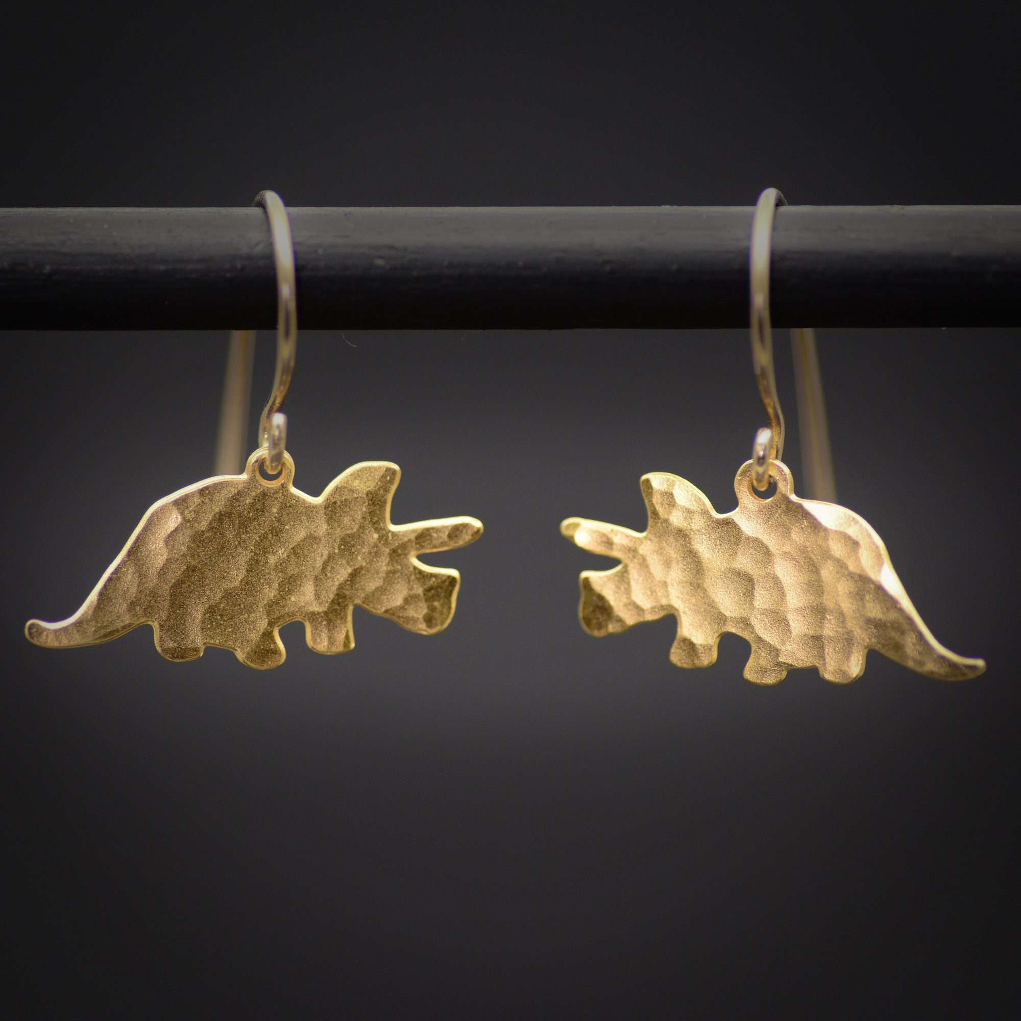 Triceratops earrings, gold dinosaur dangle earrings